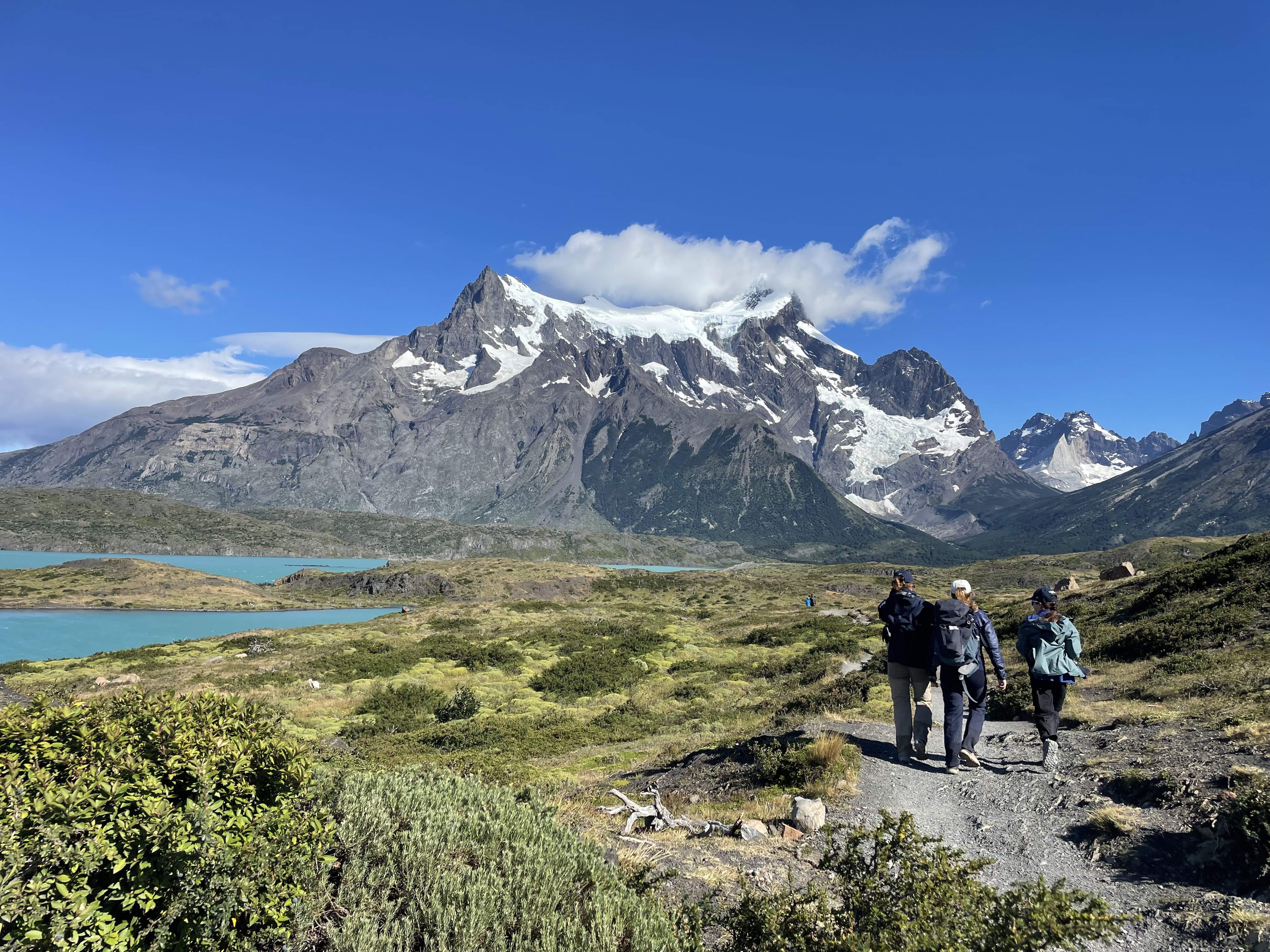 Three people hiking in mountains